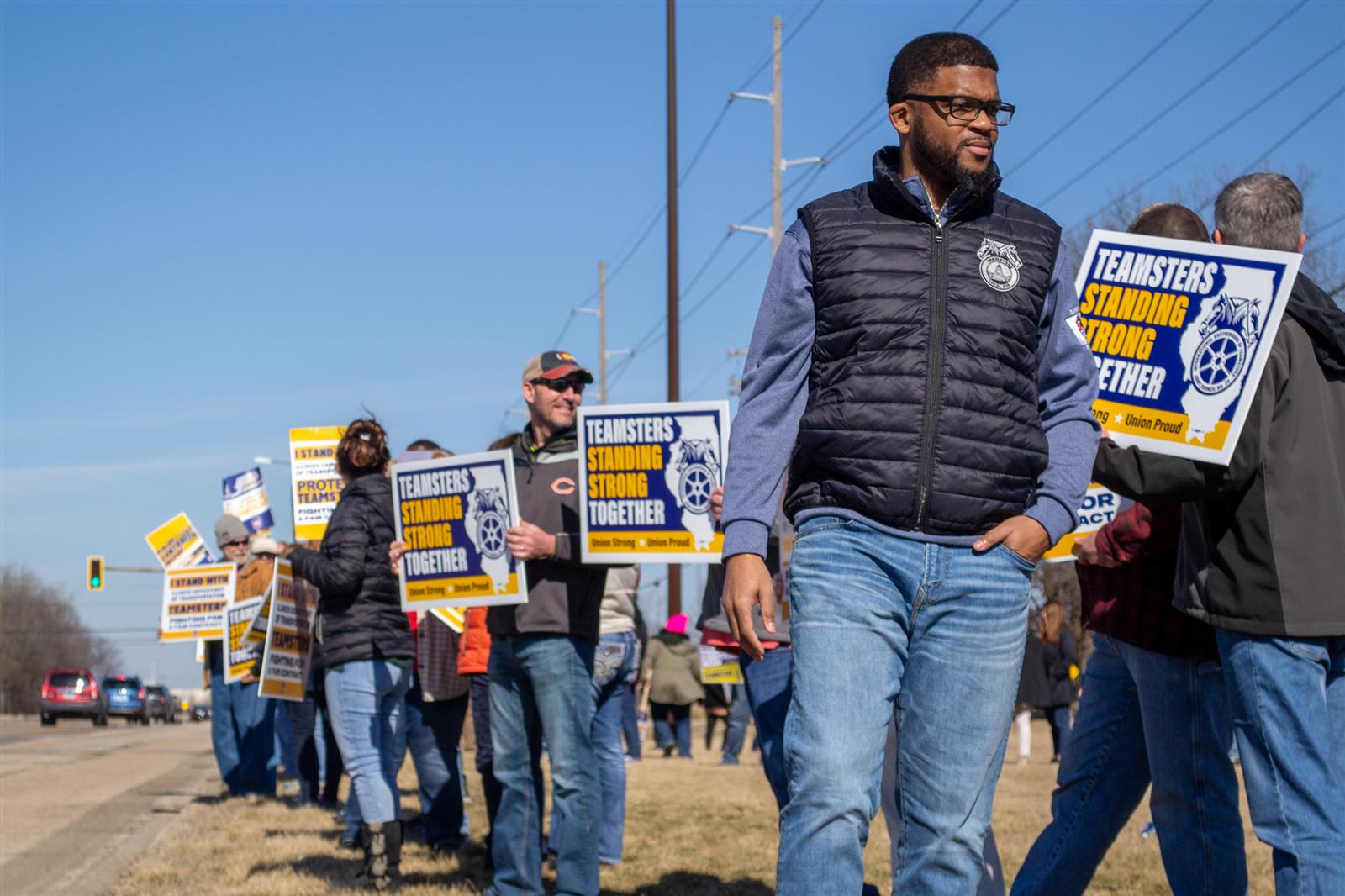 Members of the Teamsters Local 916 union rally