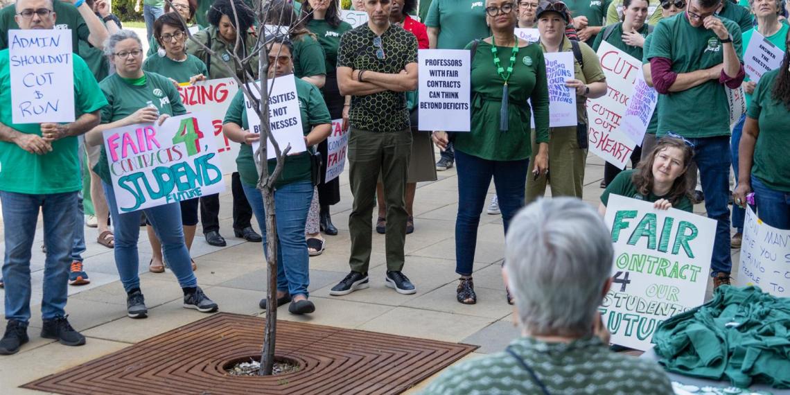 Northeastern Illinois University faculty union president Nancy Matthews speaks to union members and other attendees at a rally outside the university’s Board of Trustees meeting on April 13. (Capitol News Illinois photo by Andrew Adams)