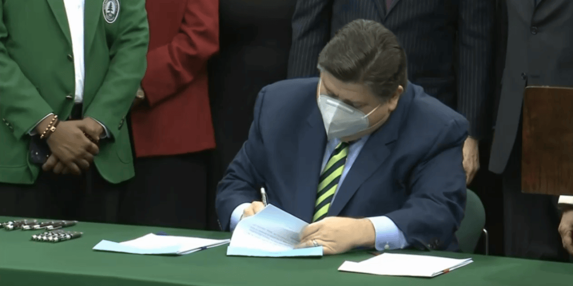 Gov. JB Pritzker sings the state's Fiscal Year 2023 operating budget at Chicago State University Tuesday. (Credit: Blueroomstream.com)