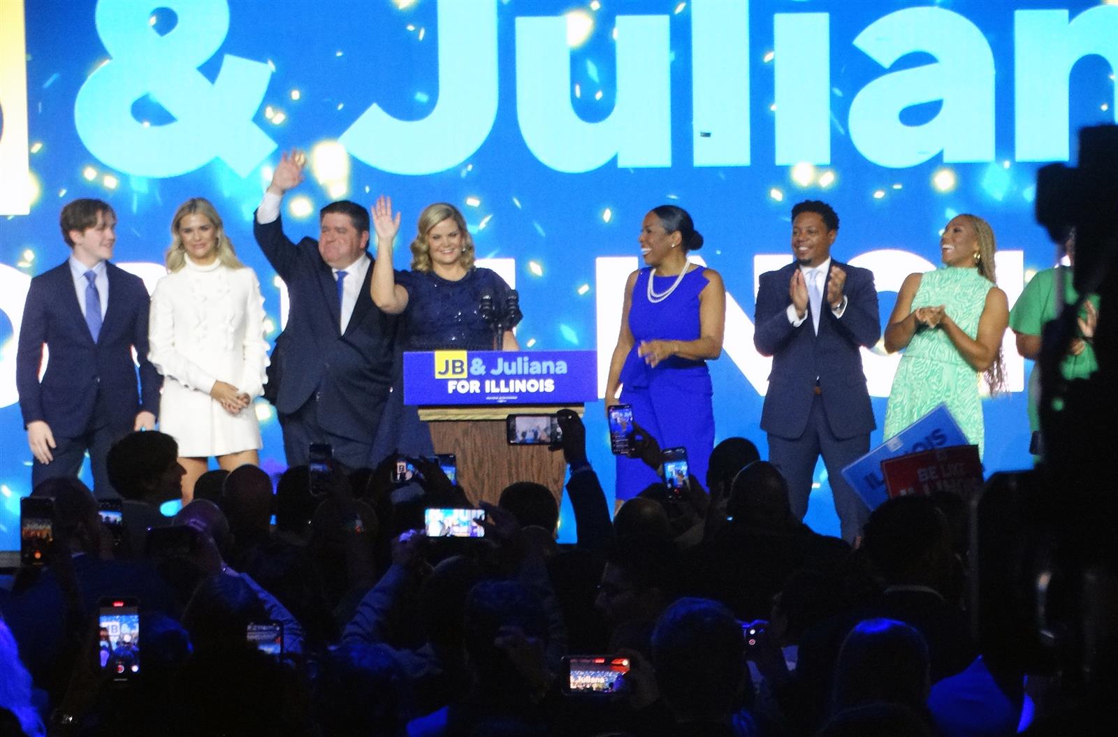 Gov. JB Pritzker and Lt. Gov. Juliana Stratton stand with their families