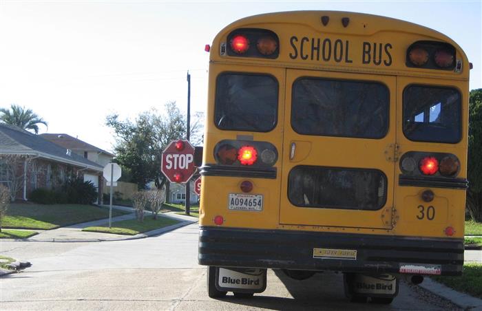 House OKs doubling of fines for drivers who pass stopped school buses