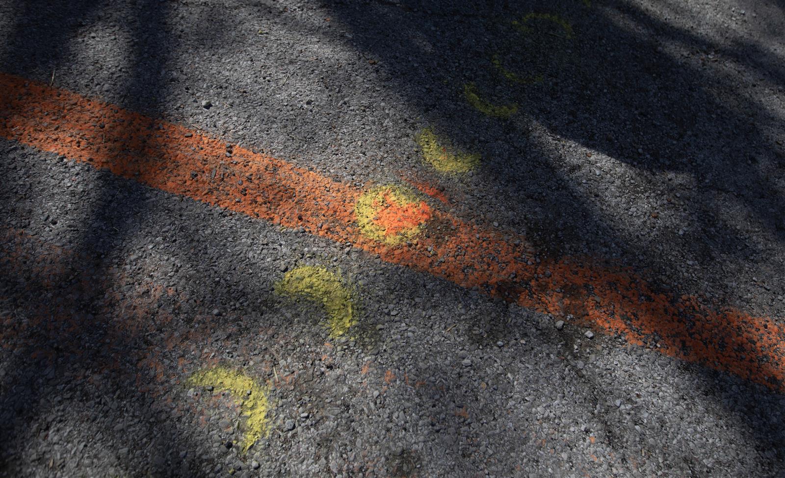 orange painted line of moon phases to signify the cross-over of the eclipse totality paths April 8, 2024