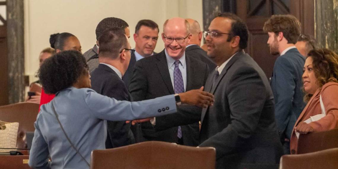 Lawmakers in the Illinois Senate celebrating