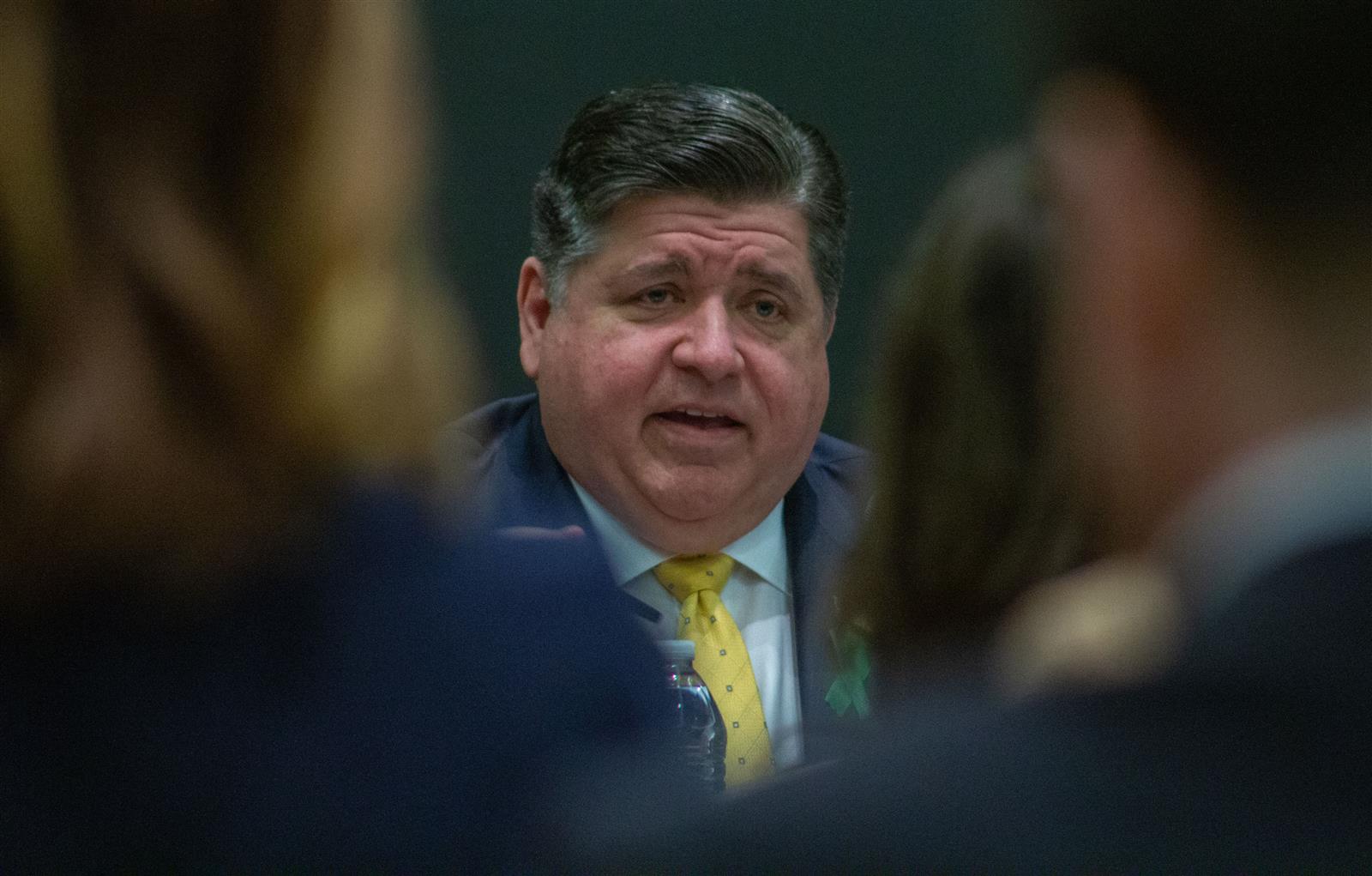 Gov. JB Pritzker speaks to an audience