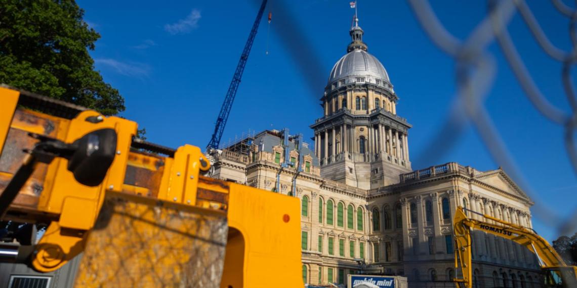 Construction vehicles are pictured outside of the Illinois State Capitol last month. (Capitol News Illinois photo by Andrew Adams)