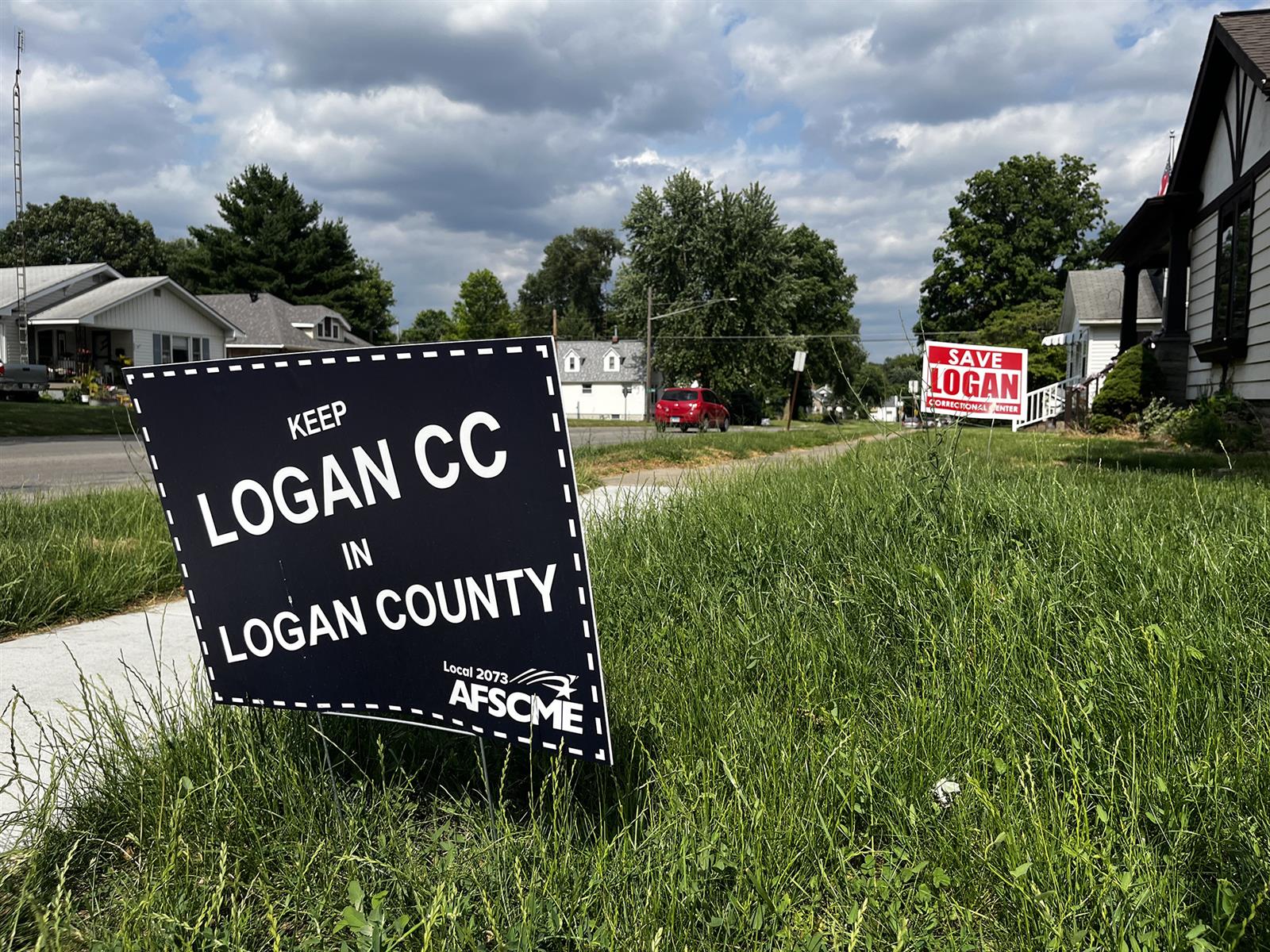 Signs expressing support for Logan Correctional Center’s continued operation