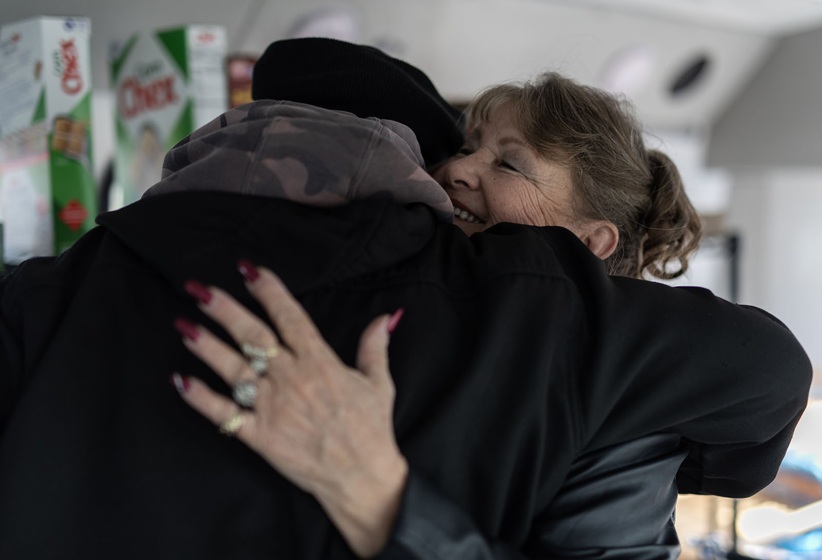 Marsha Hayes hugs Brian Tucker