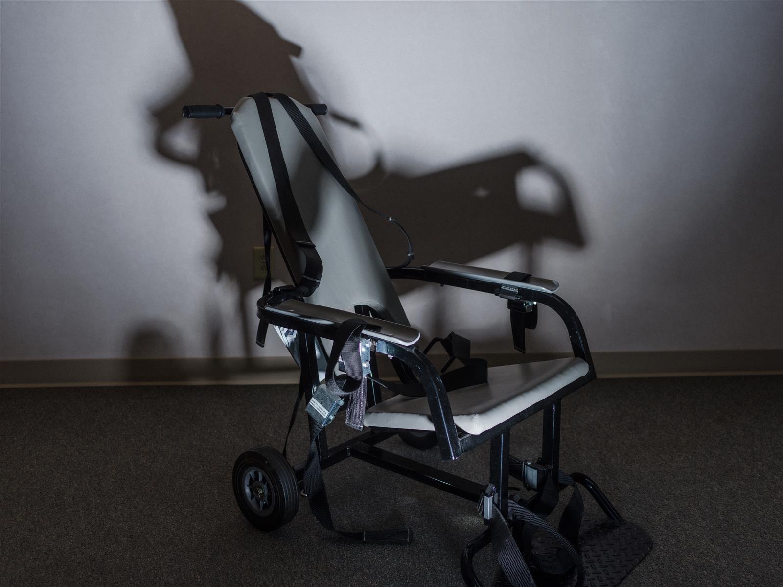 A restraint chair made by E.R.C. Inc. can be seen. The company, now known as Safety Restraint Chair Inc., previously faced scrutiny for the use of its chairs at Guantánamo Bay. (Credit: Sebastián Hidalgo, for The Illinois Answers Project).