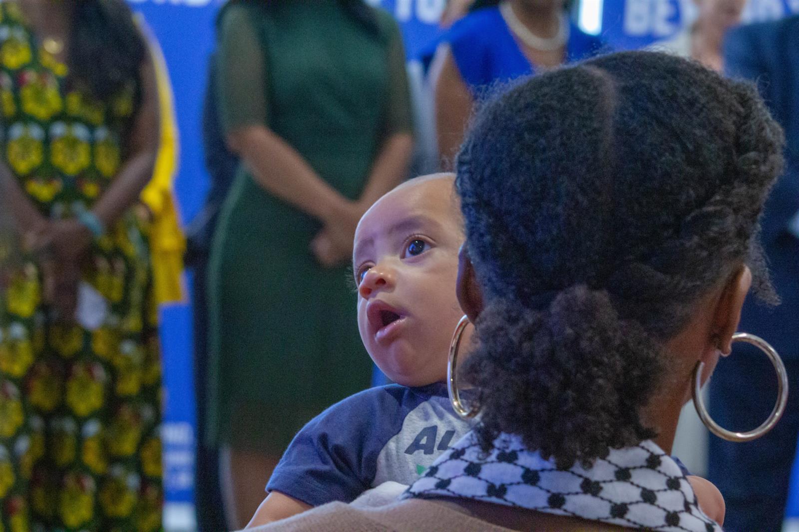 An infant and audience member
