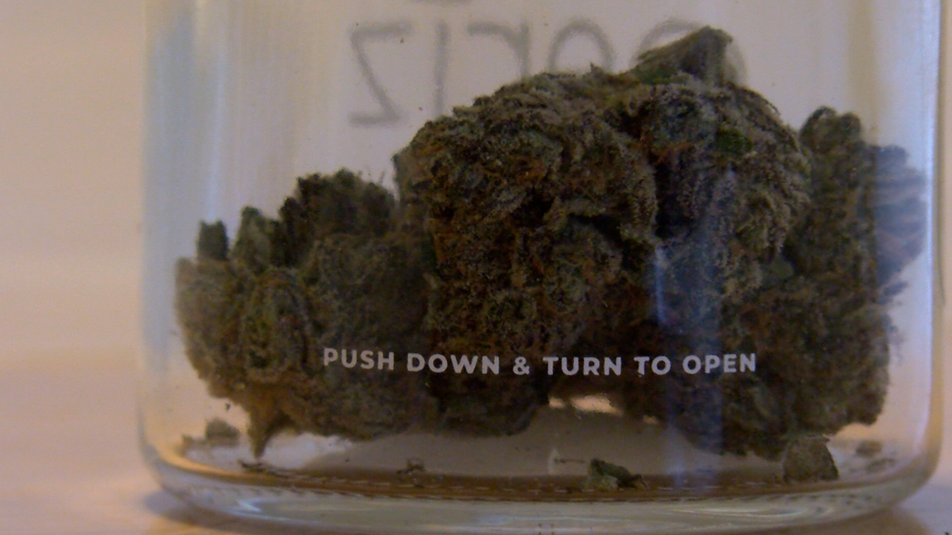 cannabis flower in a glass jar