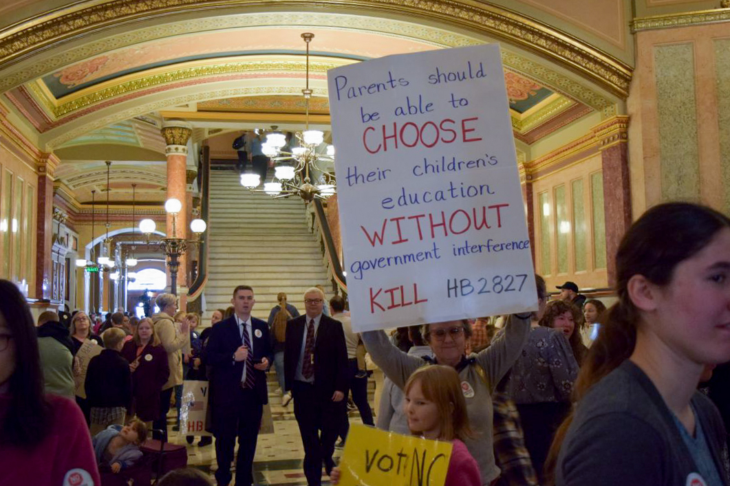 A crowd of people gathered in the Statehouse