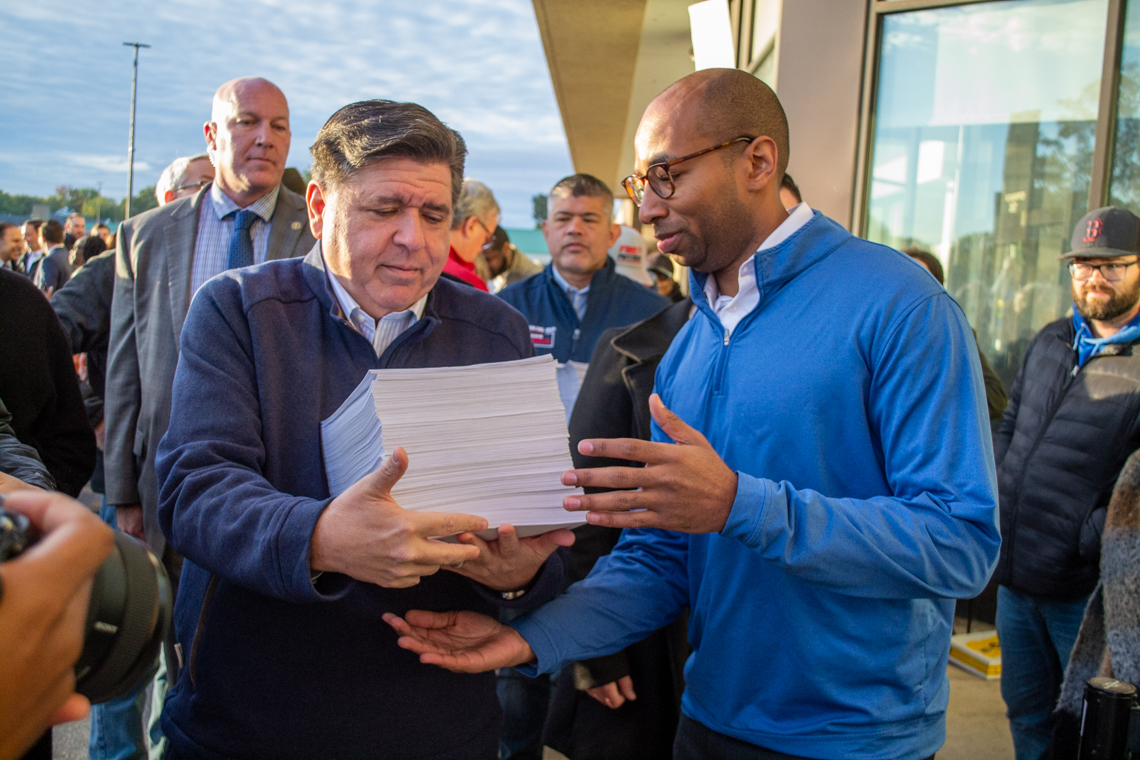 JB Pritzker and Christian Mitchell; Aaron Del Mar in background