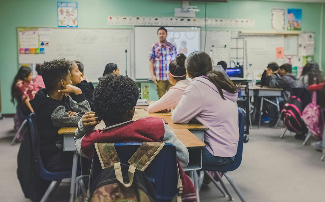 Students sit in a classroom
