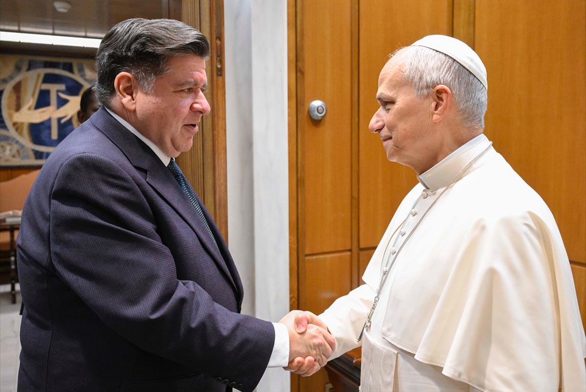 Pope Leo XIV and JB Prizter shake hands.