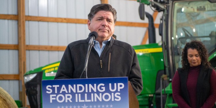 JB Pritzker speak in front of farm equipment
