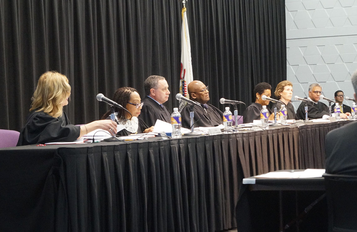Illinois Supreme Court judges sit in a session