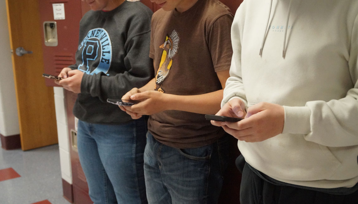 Students holding cell phones