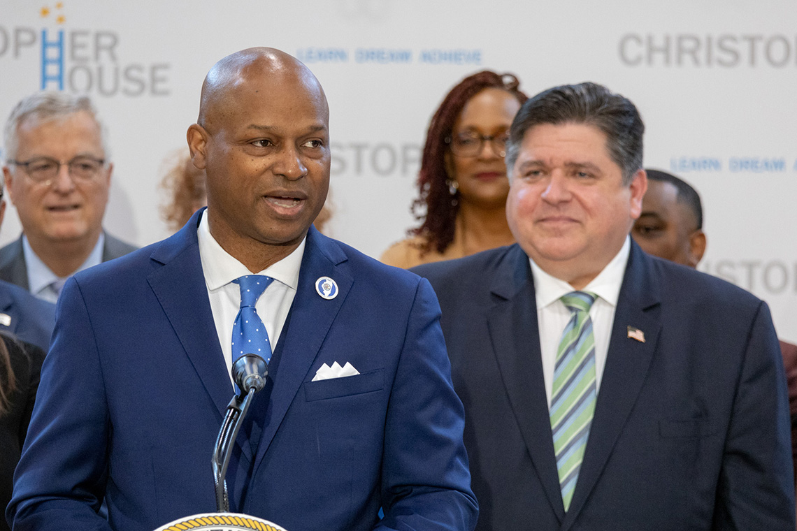 Emanuel "Chris" Welch stand beside JB Pritzker.