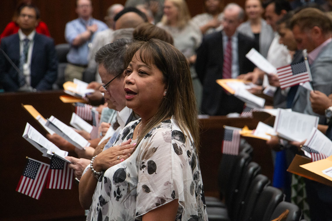 New citizens sing anthem